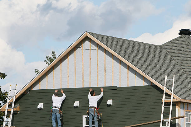 Professional Siding technician working in Heath, TX